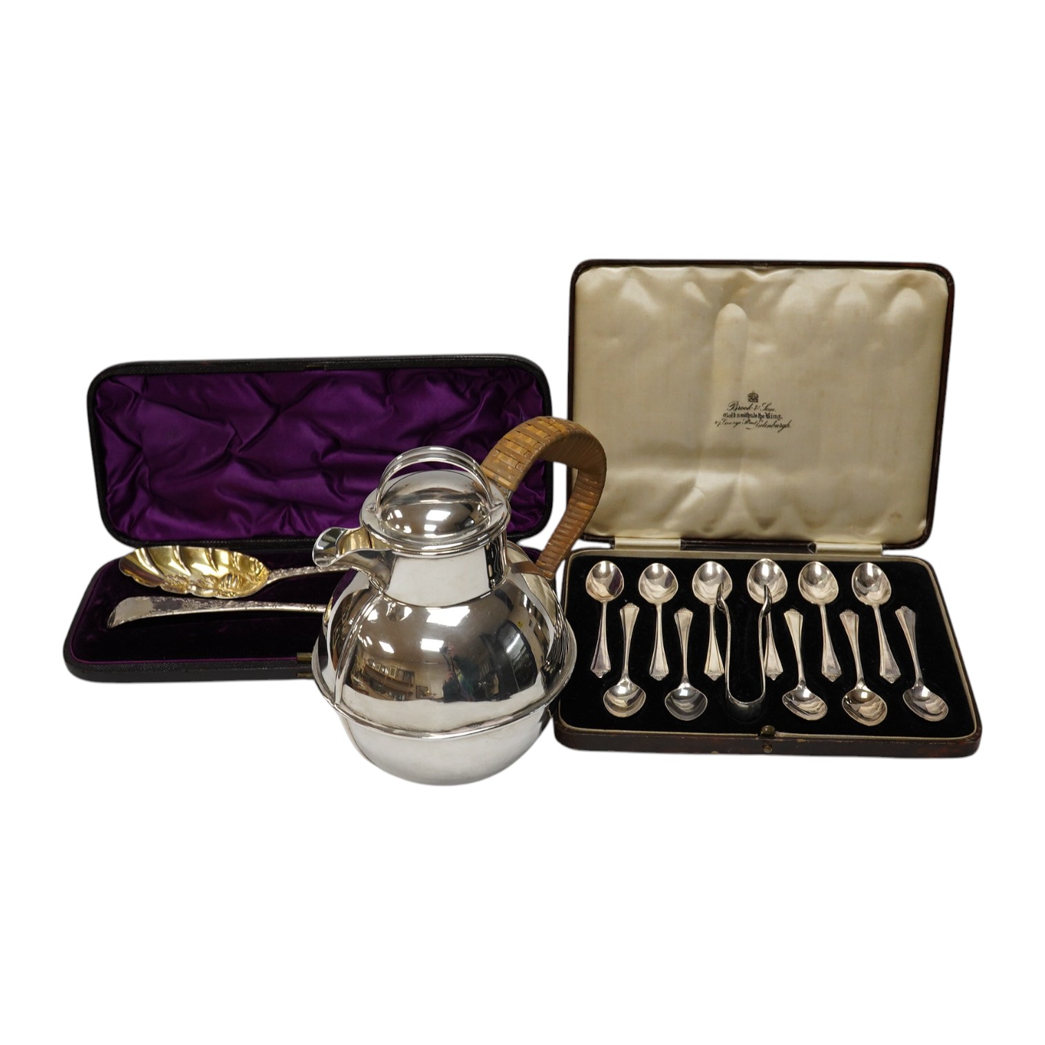 A 1960's silver Guernsey milk can, by Kenneth Tyler Key, height 16cm and two cased sets of spoons (one incomplete) including a pair of berry spoons by Thomas Eustace, Exeter, 1783. Condition - fair to good